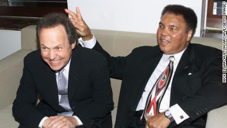 Billy Crystal and Muhammad Ali at Audemars Piguet's Time To Give Celebrity Watch Auction For Charity, held at Christie's Auction House in New York City in 2000.