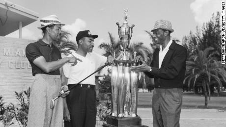 Sifford awarded the North-South Negro Golf Tournament trophy by nightclub celebrity Nat "King" Cole. 