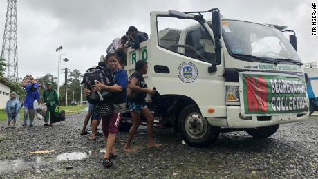 Evacuees arrive at an evacuation site in the city of Dapa, Surigao, Philippines, on Dec. 16.