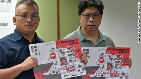 Hong Kong Journalists Association president Ronson Chan, left, and Chris Yeung pose during a press conference for the publication of the organization's annual report on July 15, 2021. 