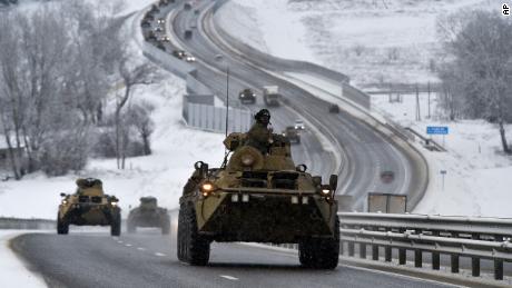 A convoy of Russian armored vehicles drives along a highway in Crimea earlier this month.