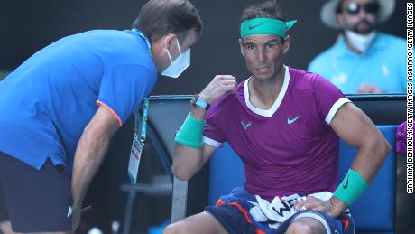 Rafael Nadal gets attention during a medical timeout in his quarterfinal match against Denis Shapovalov.