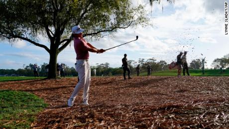 Smith punches out of the pine straw along the 18th fairway during the final round of the Players Championship.