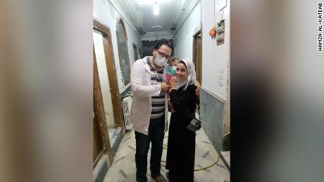Hamza, wife Waad and daughter Sama al-Kateab at a hospital in Aleppo, Syria. 