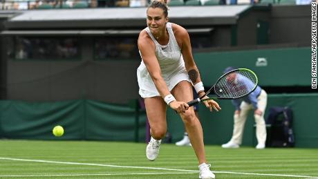 Belarus' Aryna Sabalenka returns to Romania's Monica Niculescu in their first round of women's singles at the 2021 Wimbledon Championships.