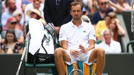 Daniil Medvedev sits between sets in the second round of his men's singles match against Carlos Alcaraz during day four of Wimbledon 2021.