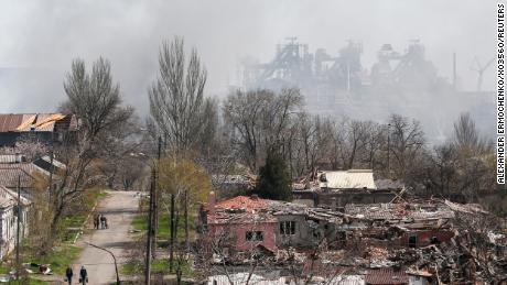 Smoke rises above the Azovstal factory when nearby buildings were smashed to the ground in Mariupol on April 18. 