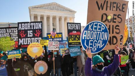 Protesters gather before the U.S. Supreme Court as judges hear arguments in Dobbs v. Jackson Women's Health, a case over a Mississippi law banning most abortions after 15 weeks, on Dec. 1, 2021 in Washington, DC. (Photo by Chip Somodevilla/Getty Images)