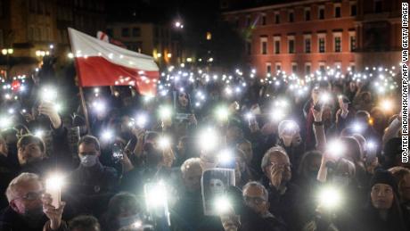 Protesters in Warsaw celebrate the first anniversary of a ruling by the Polish Constitutional Court imposing an almost complete ban on abortion, and commemorate the death of a young pregnant Polish woman who was denied the procedure.