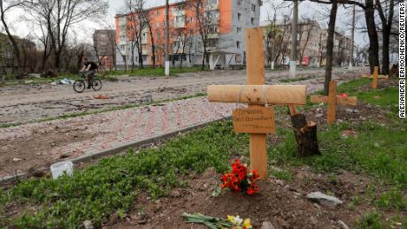 A view shows graves of civilians killed during the Ukraine-Russia conflict along the road in Mariupol on April 18, 2022.