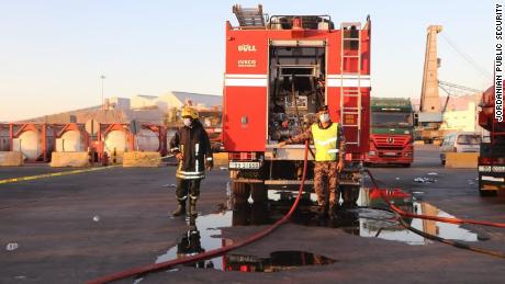 Emergency services respond Monday to the poisonous gas leak at the port of Aqaba in Jordan.