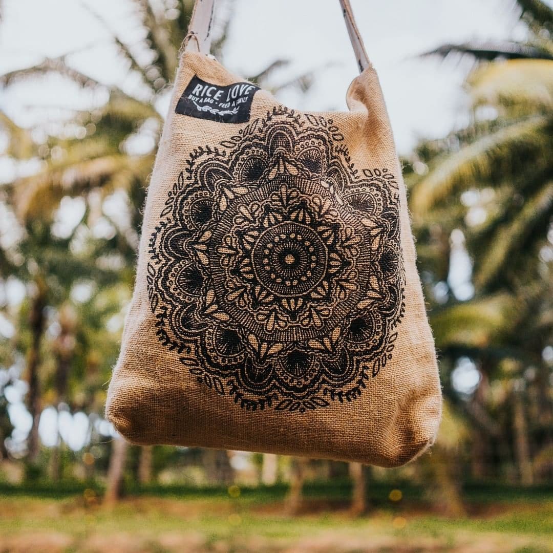 The bag is handmade from recycled jute/jute rice bags.