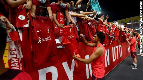 Alexander-Arnold signs autographs at the end of the open training session on July 11 in Bangkok, Thailand. 