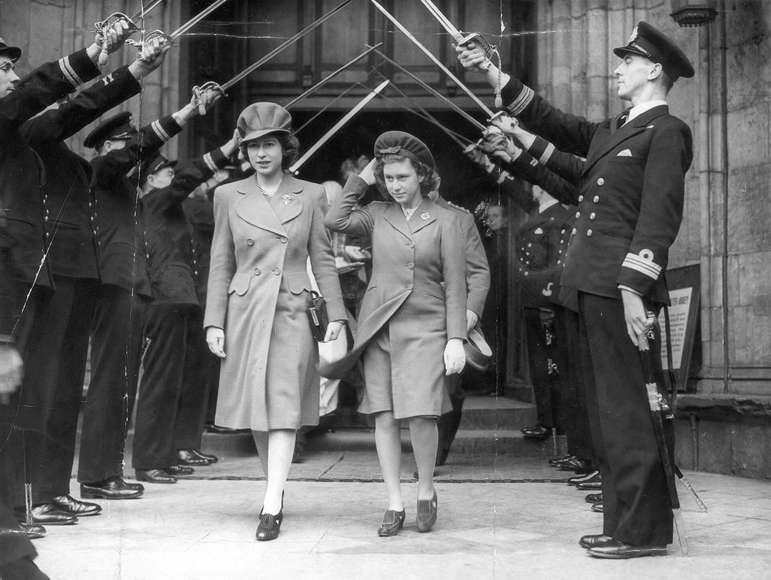 Black and white photograph of Princess Elizabeth exiting a stone church door as soldiers arch their swords over the princesses. Elizabeth wears a hat with cap and a coat with a brooch.