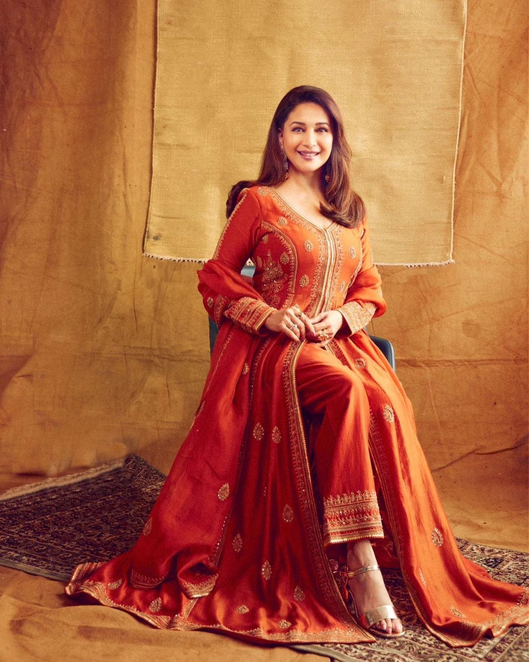Add a pop of color to your festivities with Jigar Mali's Burnt Orange Chanderi Jacket Set.