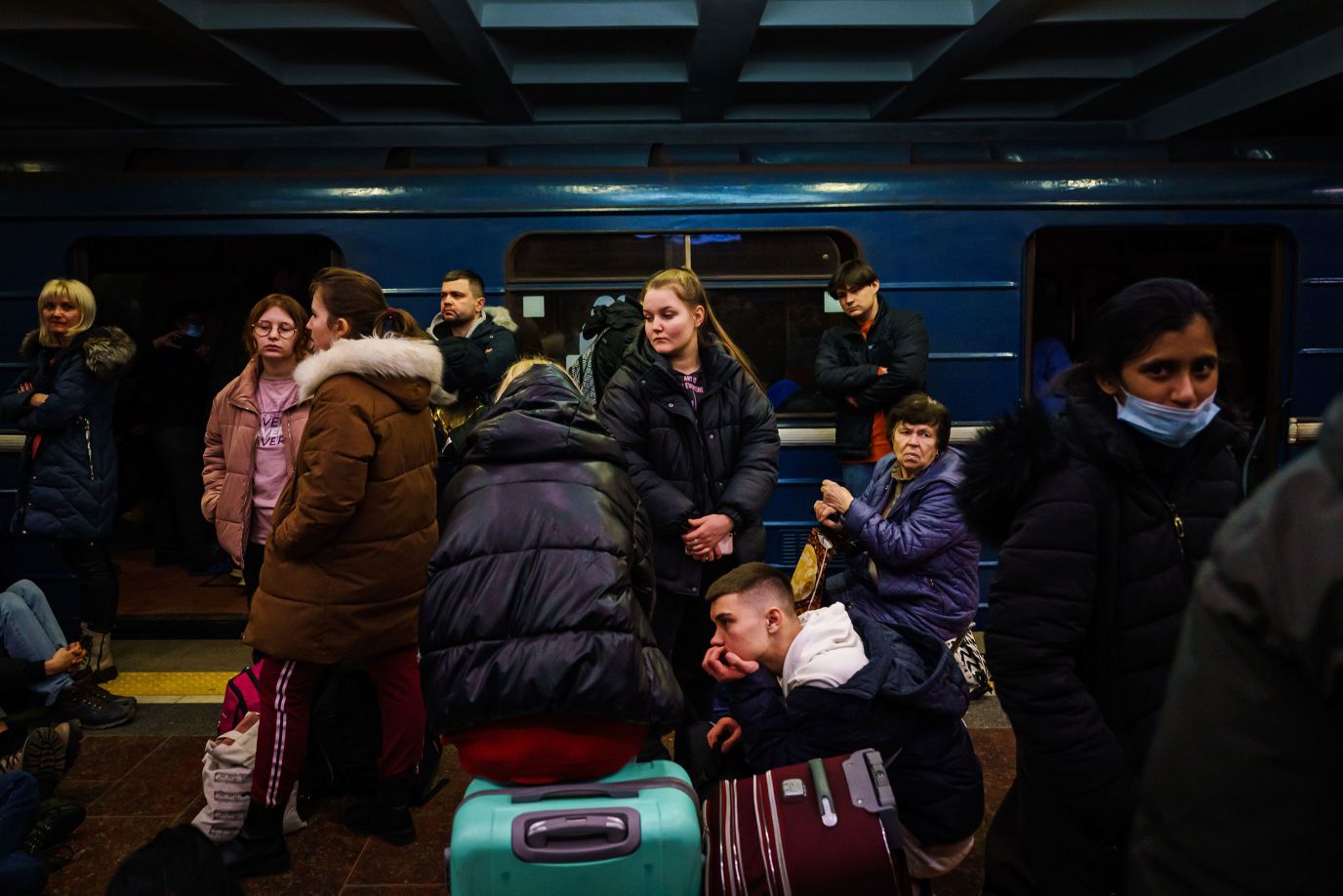 People take shelter in a metro station in Kharkiv, Ukraine, on Feb. 24. 